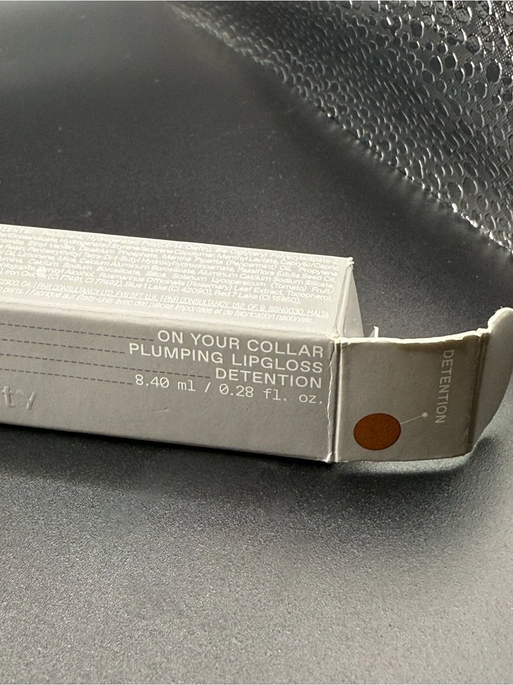 R.E.M Beauty on your collar plumping lipgloss—-Detention